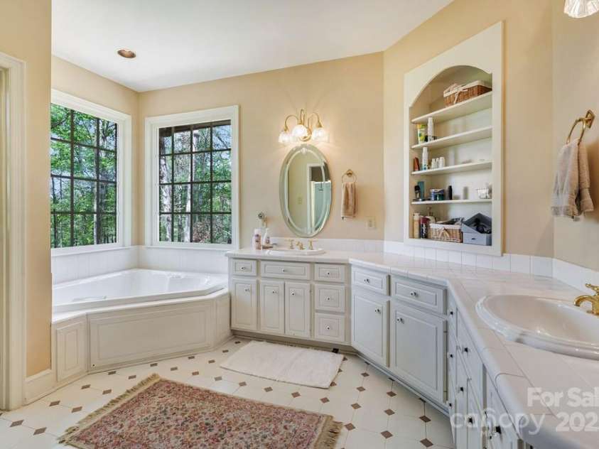 201 Hughes Creek, Columbus, NC 28722.  MLS# CAR4259120, YatesRealty ID 15229. Primary bathroom with Jacuzzi & shower