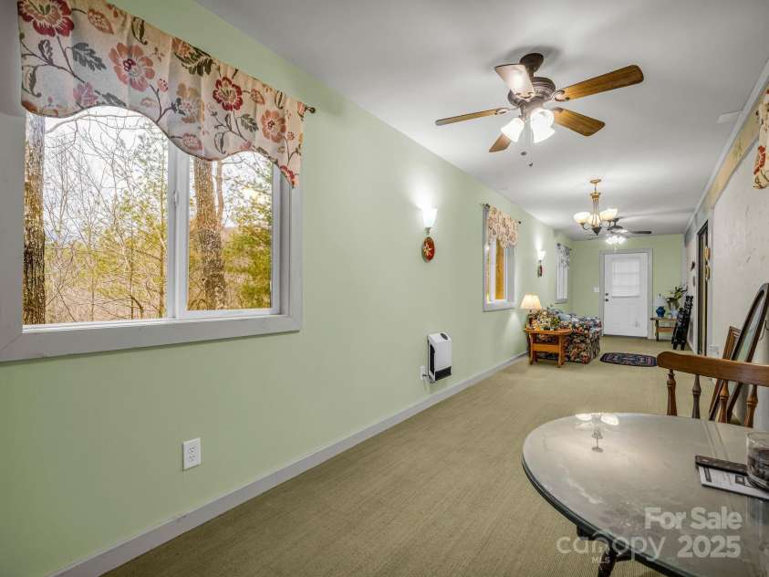 526 Shannons Walk, Lake Lure, NC 28746.  MLS# CAR4300431, YatesRealty ID 15235. Space in the basement outside of the bedroom,den and bath.