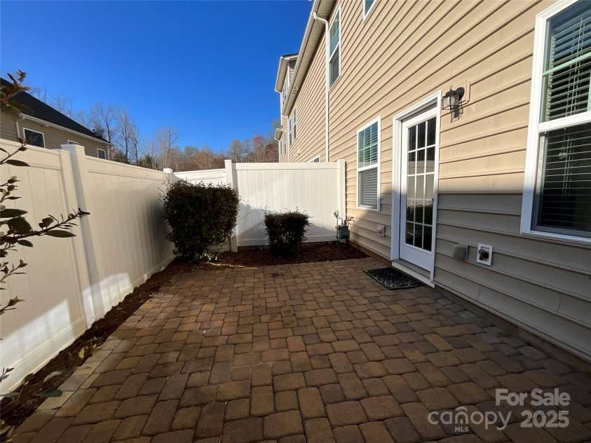 113 Burlingame Court, Mooresville, NC 28117.  MLS# CAR4228046, YatesRealty ID 1524. Backyard has large paved patio area.