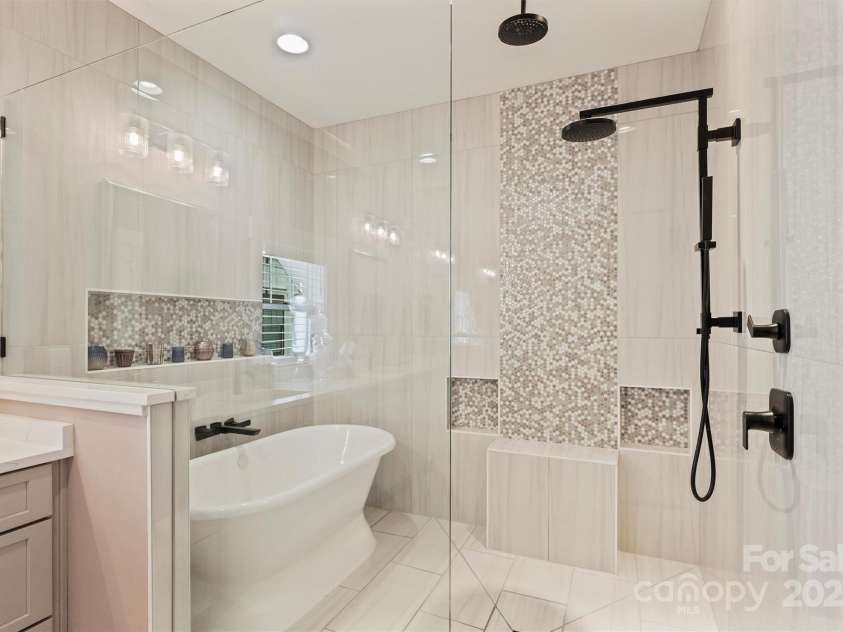 2829 Holt Street, Charlotte, NC 28205.  MLS# CAR4260071, YatesRealty ID 15243. Soaking Tub and Custom Shower