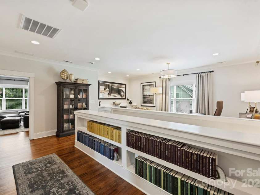 2829 Holt Street, Charlotte, NC 28205.  MLS# CAR4260071, YatesRealty ID 15243. Upstairs Landing with build in bookcase