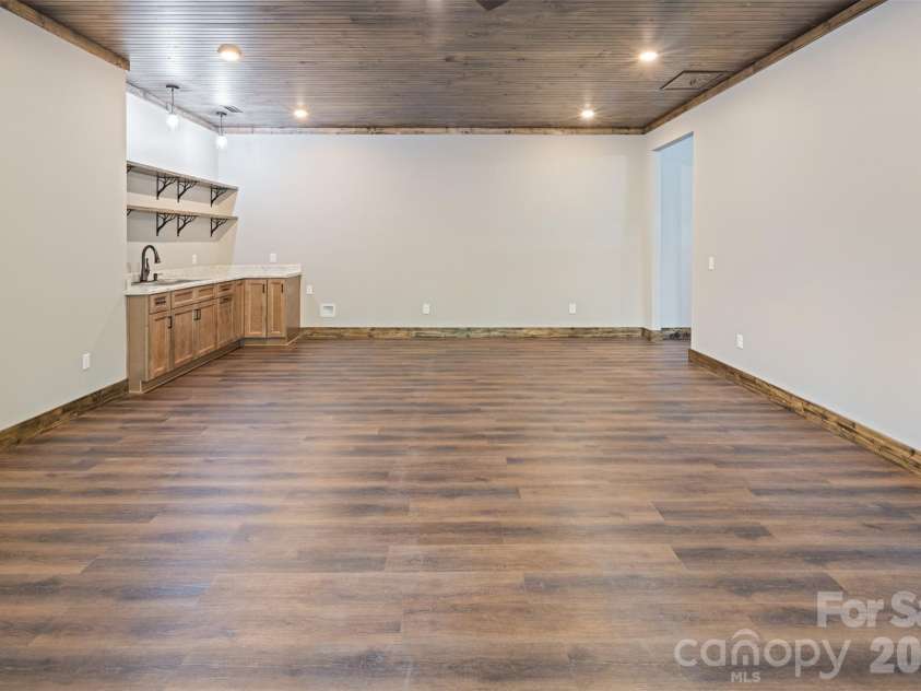 115 Pine Burr Drive, Purlear, NC 28665.  MLS# CAR4374403, YatesRealty ID 15245. Lower Level - Den with Wet Bar