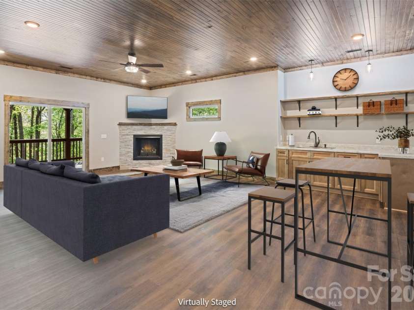 115 Pine Burr Drive, Purlear, NC 28665.  MLS# CAR4374403, YatesRealty ID 15245. Lower Level - Den with Wet Bar & Gas Log Fireplace - Virtually Staged