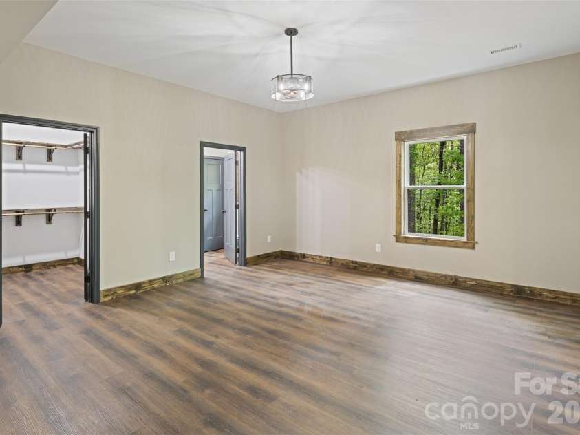 115 Pine Burr Drive, Purlear, NC 28665.  MLS# CAR4374403, YatesRealty ID 15245. Lower Level - Primary Bedroom Suite