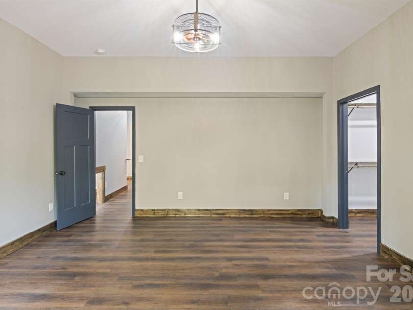 115 Pine Burr Drive, Purlear, NC 28665.  MLS# CAR4374403, YatesRealty ID 15245. Lower Level - Primary Bedroom Suite