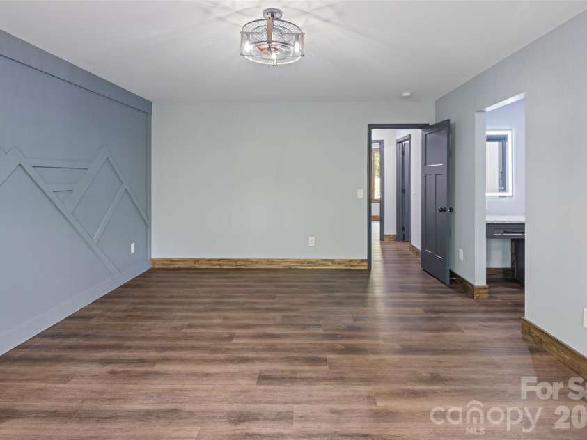 115 Pine Burr Drive, Purlear, NC 28665.  MLS# CAR4374403, YatesRealty ID 15245. Main Level - Primary Bedroom Suite