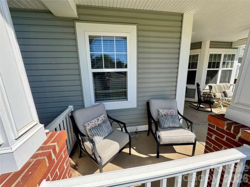 4633 Triumph Drive, Concord, NC 28027.  MLS# CAR4374411, YatesRealty ID 15247. Inviting front porch is made for relaxing.