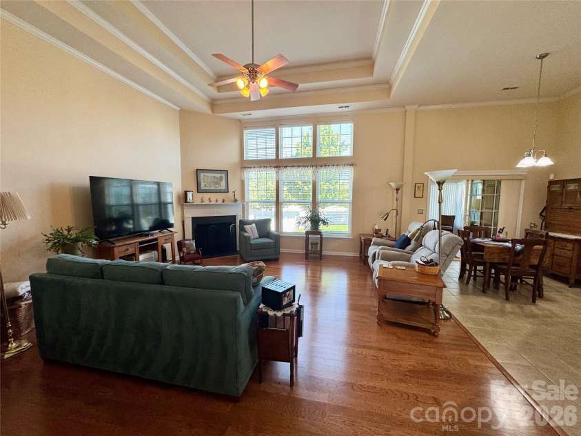 4633 Triumph Drive, Concord, NC 28027.  MLS# CAR4374411, YatesRealty ID 15247. Large living room with tray ceiling