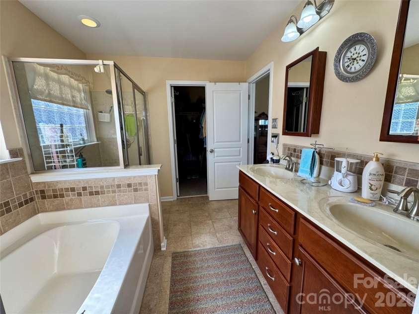 4633 Triumph Drive, Concord, NC 28027.  MLS# CAR4374411, YatesRealty ID 15247. Primary bath has a large walk-in closet