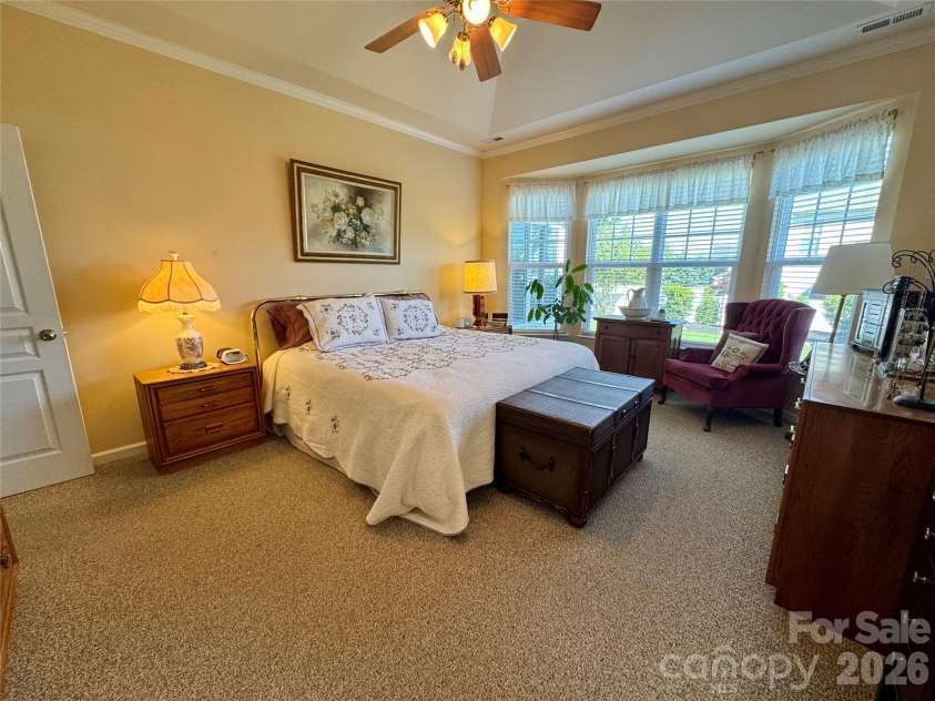 4633 Triumph Drive, Concord, NC 28027.  MLS# CAR4374411, YatesRealty ID 15247. Primary bedroom with large bay window and tray ceiling.