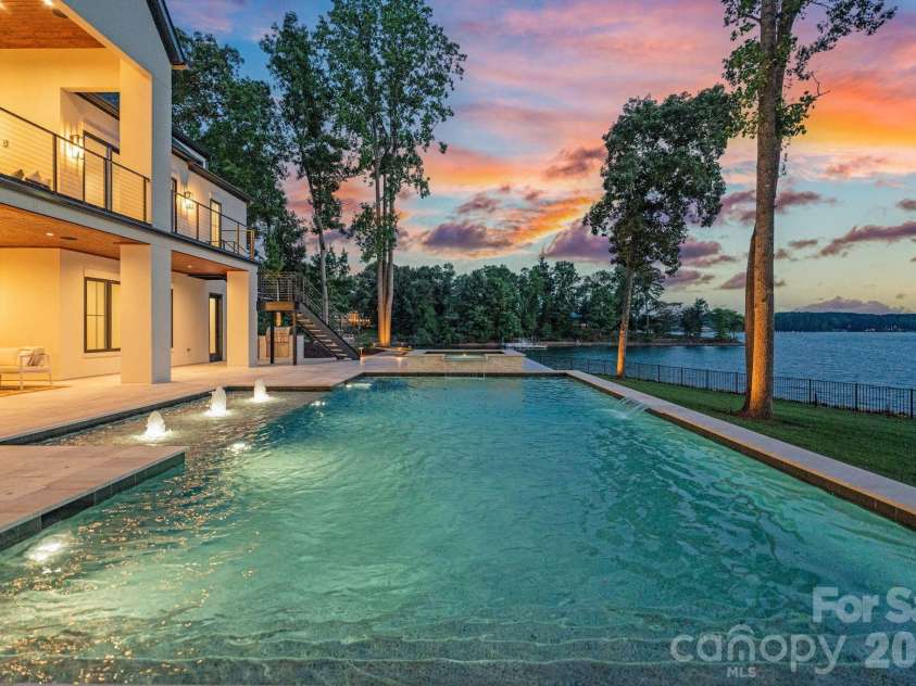 127 Tinker Place, Troutman, NC 28166.  MLS# CAR4394481, YatesRealty ID 15255. Sunset views from your heated salt-water pool and spa 