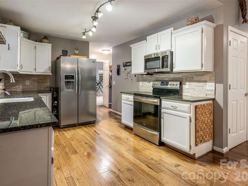 19 Forge Drive, Mills River, NC 28759.  MLS# CAR4344068, YatesRealty ID 1526. Updated Kitchen FeaturesGranite and Stainless Steel