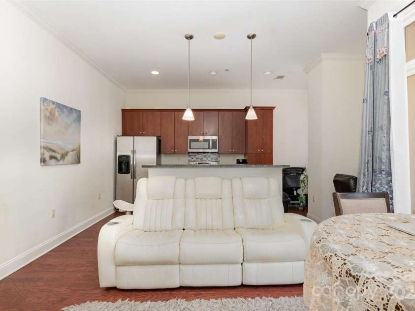 230 Tryon Street, Charlotte, NC 28202.  MLS# CAR4321048, YatesRealty ID 1527. View of Kitchen from the Living Room