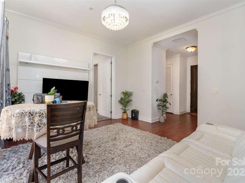 230 Tryon Street, Charlotte, NC 28202.  MLS# CAR4321048, YatesRealty ID 1527. View of Living Room looking towards Entrance and access to Bedrooms and Bathroom