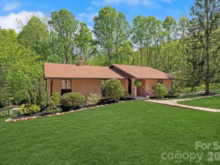 52 Mark Twain Road, Asheville, NC 28805.  MLS# CAR4372680, YatesRealty ID 15273. The grass has been digitally enhanced. 