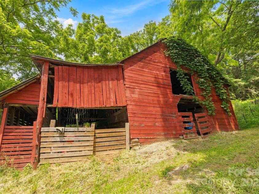 51 HOMEFIRE COVE Cove, Leicester, NC 28748.  MLS# CAR4269158, YatesRealty ID 1528. Americana barn with stalls and hay loft