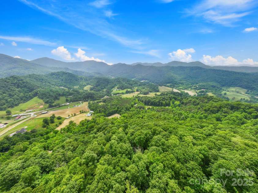 51 HOMEFIRE COVE Cove, Leicester, NC 28748.  MLS# CAR4269158, YatesRealty ID 1528. Mountains mountains everywhere! This quiet hamlet in Buncombe county is minutes to everything but feels worlds away.