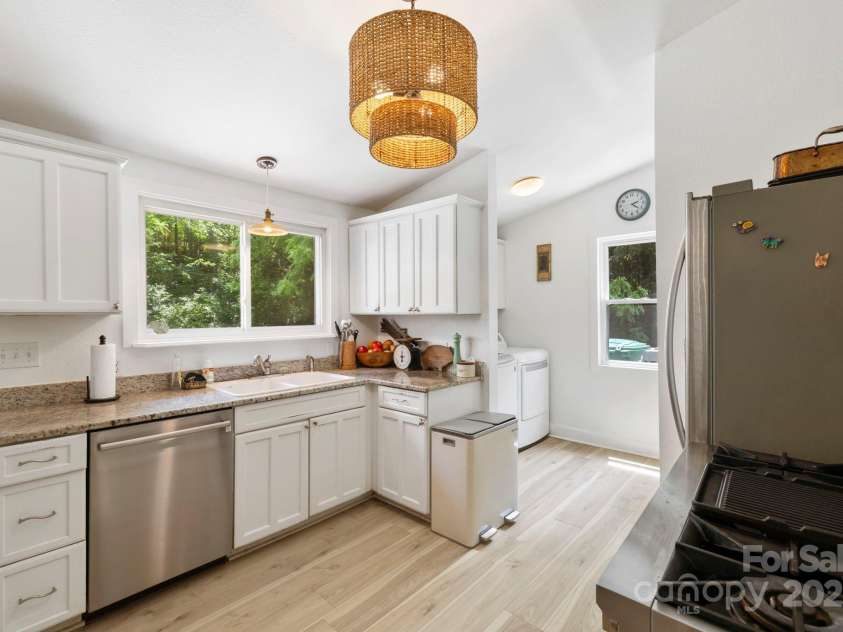 51 HOMEFIRE COVE Cove, Leicester, NC 28748.  MLS# CAR4269158, YatesRealty ID 1528. Open airy kitchen with laundry adjacent