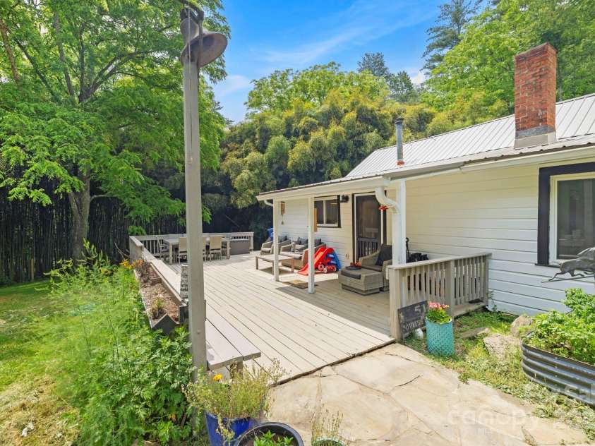 51 HOMEFIRE COVE Cove, Leicester, NC 28748.  MLS# CAR4269158, YatesRealty ID 1528. Sunny back deck off kitchen overlooks Koi pond