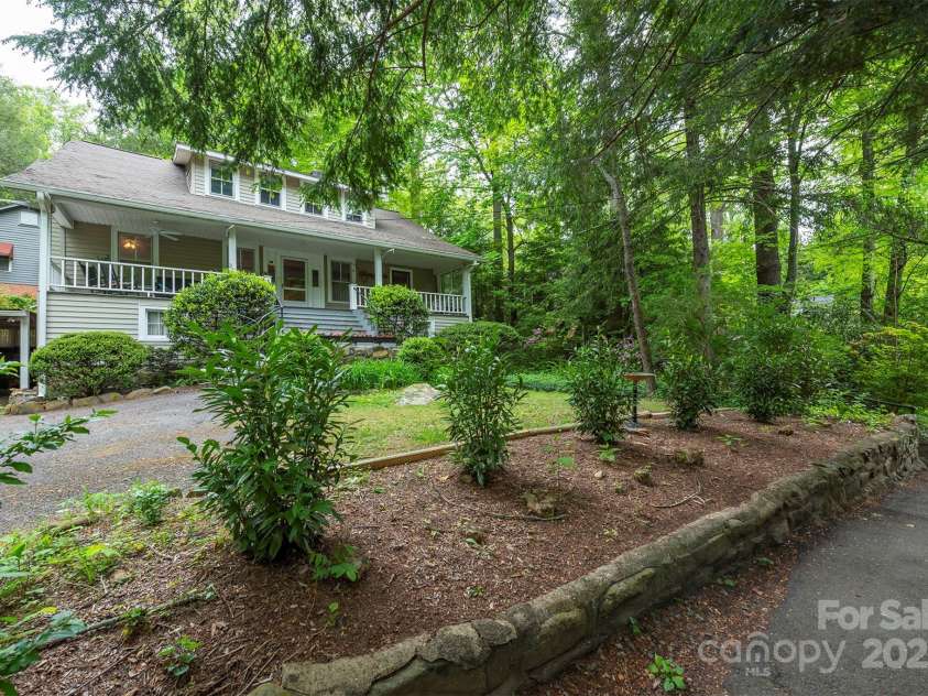 223 Assembly Drive, Montreat, NC 28757.  MLS# CAR4256904, YatesRealty ID 15288. Attractive front yard with path leading to Lake Susan.