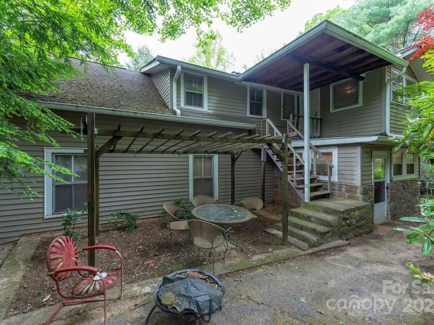 223 Assembly Drive, Montreat, NC 28757.  MLS# CAR4256904, YatesRealty ID 15288. Back Patio and entrance to upstairs office.