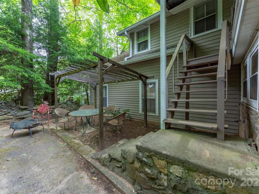 223 Assembly Drive, Montreat, NC 28757.  MLS# CAR4256904, YatesRealty ID 15288. Back Patio and entrance to upstairs office.