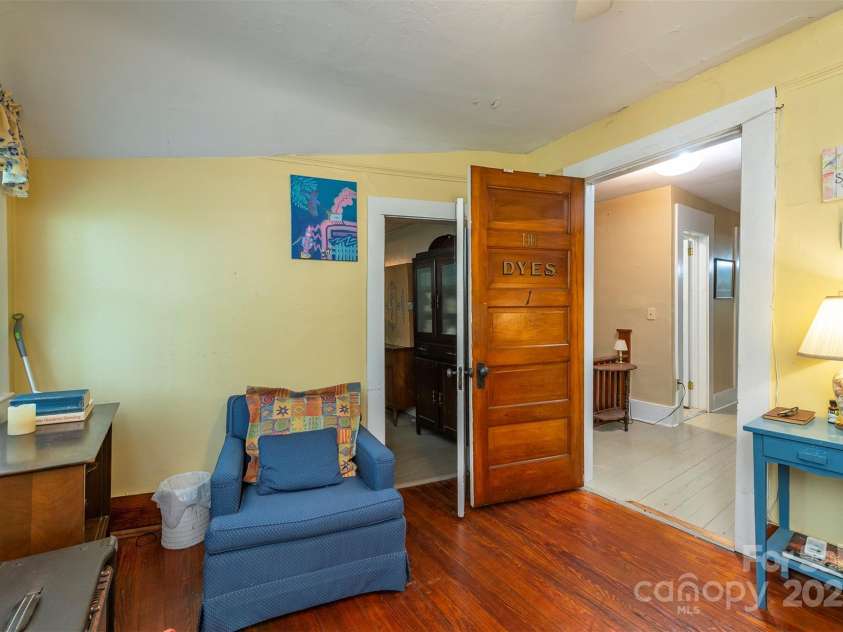 223 Assembly Drive, Montreat, NC 28757.  MLS# CAR4256904, YatesRealty ID 15288. BR 1 upstairs has good natural lighting, a large closet, and leads to a kitchenette, and a sitting room.