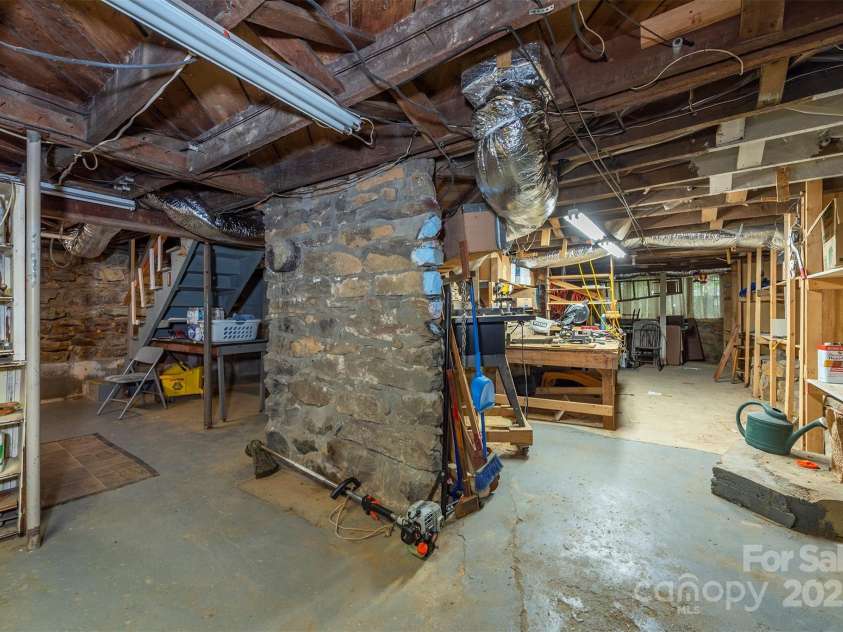 223 Assembly Drive, Montreat, NC 28757.  MLS# CAR4256904, YatesRealty ID 15288. Phenomenal basement with workshop areas, additional woodstove, and tremendous storage ares.