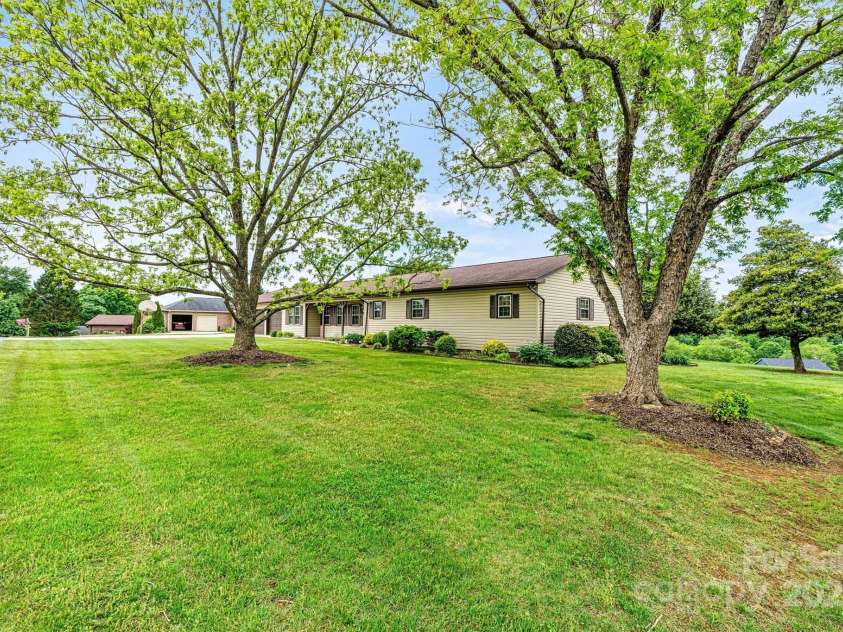 2 Honeysuckle Way, Granite Falls, NC 28630.  MLS# CAR4234653, YatesRealty ID 15292. Focused Front/Side Yar View