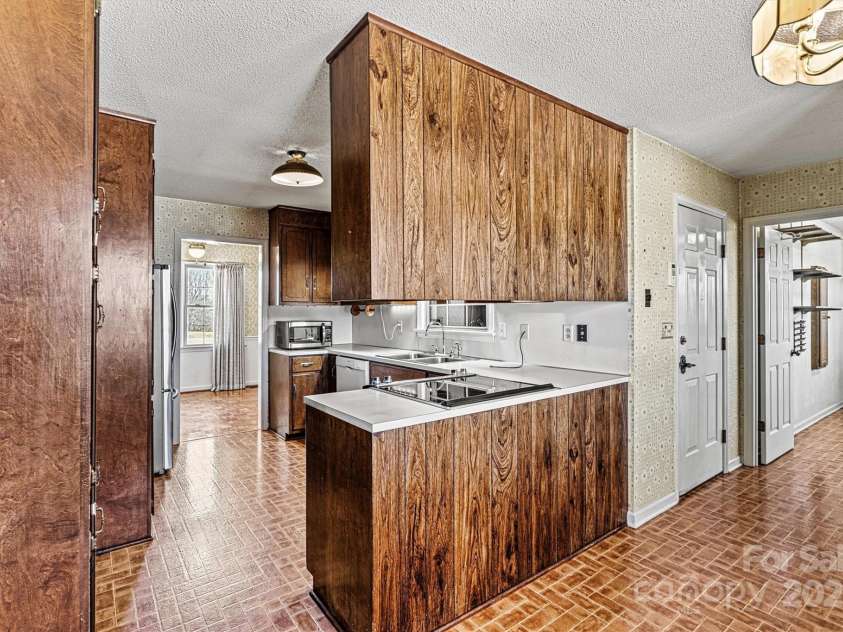2 Honeysuckle Way, Granite Falls, NC 28630.  MLS# CAR4234653, YatesRealty ID 15292. Kitchen with Dining and Laundry Room Entry View