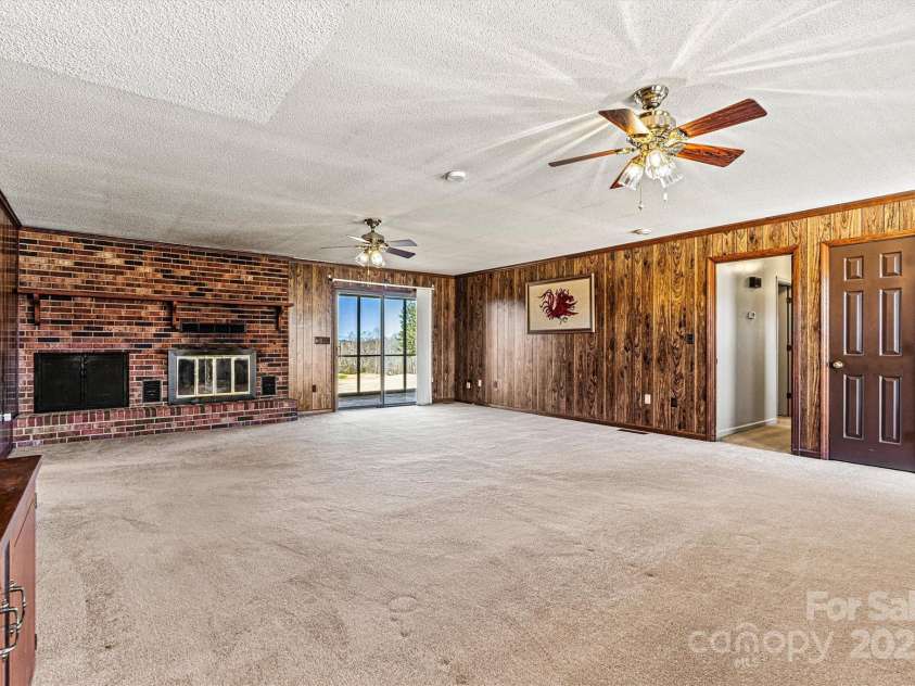 2 Honeysuckle Way, Granite Falls, NC 28630.  MLS# CAR4234653, YatesRealty ID 15292. Living Room/Screened Porch View
