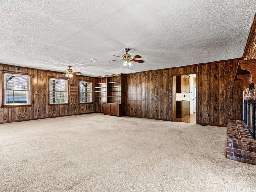 2 Honeysuckle Way, Granite Falls, NC 28630.  MLS# CAR4234653, YatesRealty ID 15292. Living Room/Window/Kitchen Entry View