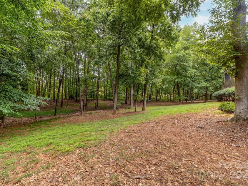 14504 Henry Harrison Stillwell Drive, Huntersville, NC 28078.  MLS# CAR4288907, YatesRealty ID 1530. Cleared area in back yard