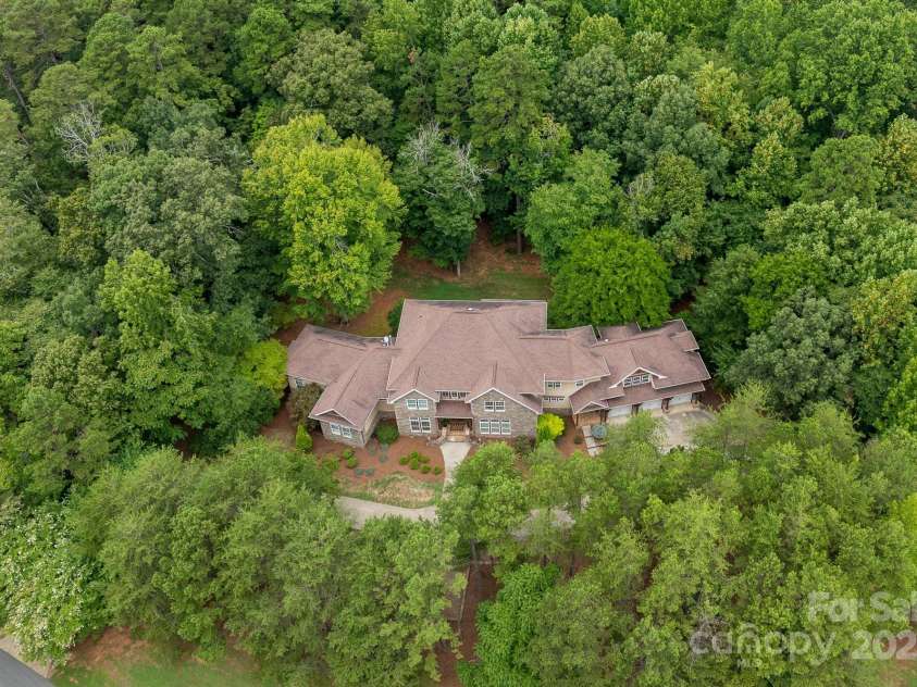 14504 Henry Harrison Stillwell Drive, Huntersville, NC 28078.  MLS# CAR4288907, YatesRealty ID 1530. Private treed lot in gated community