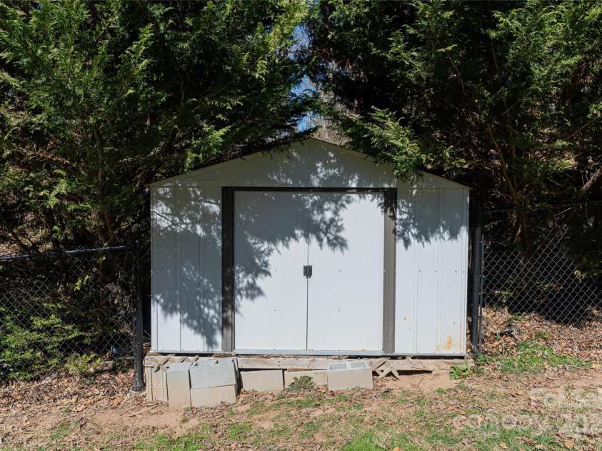 31 White Pine Drive, Asheville, NC 28805.  MLS# CAR4227367, YatesRealty ID 15303. Backyard shed