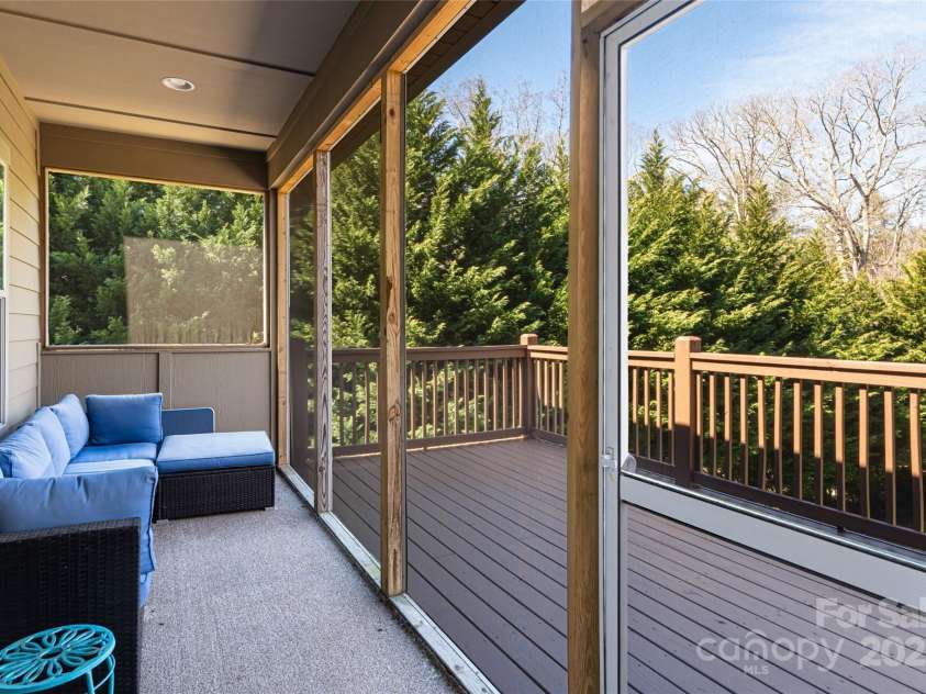 31 White Pine Drive, Asheville, NC 28805.  MLS# CAR4227367, YatesRealty ID 15303. Main level screened porch