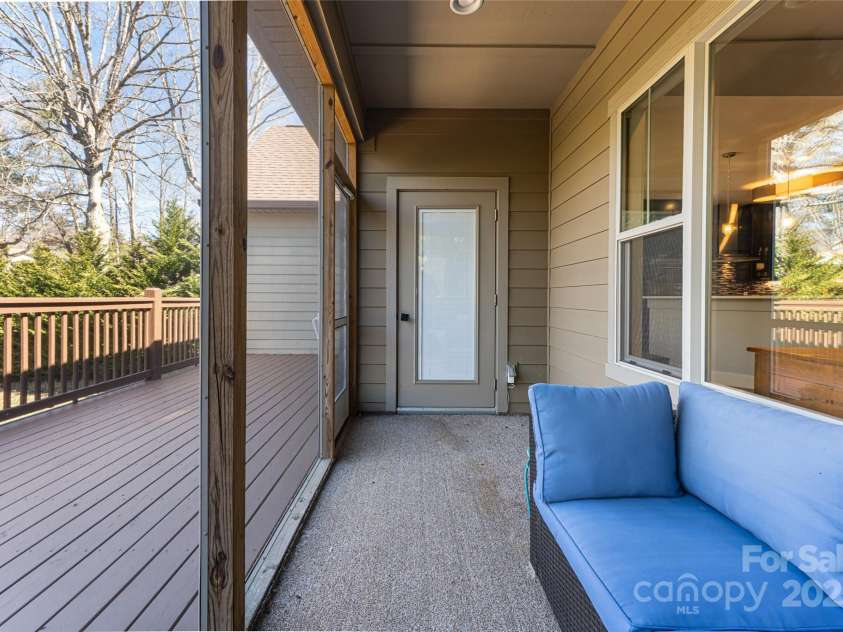 31 White Pine Drive, Asheville, NC 28805.  MLS# CAR4227367, YatesRealty ID 15303. Main level screened porch