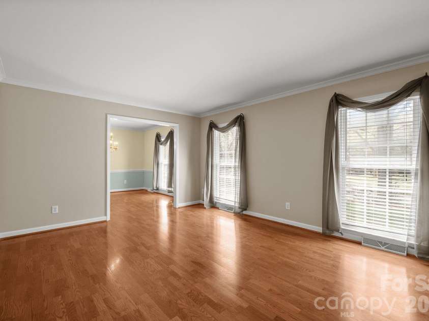 7737 Ridgeloch Place, Charlotte, NC 28226.  MLS# CAR4357956, YatesRealty ID 15304. Living Room into Dining