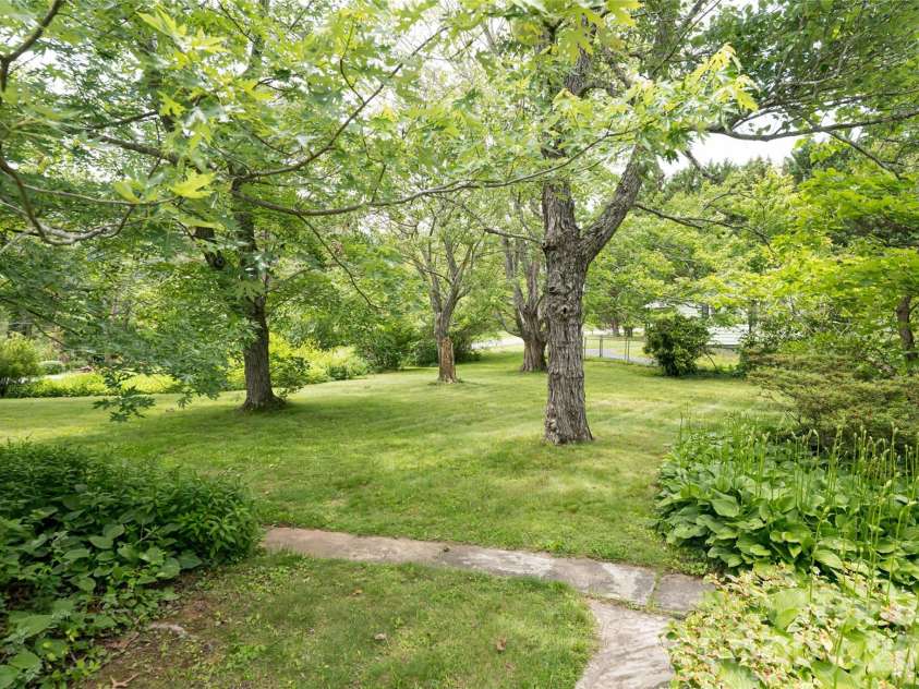 75 Cisco Road, Asheville, NC 28805.  MLS# CAR4277193, YatesRealty ID 15312. Expansive Level Yard