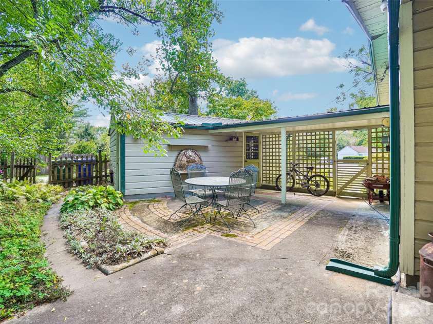 75 Cisco Road, Asheville, NC 28805.  MLS# CAR4425797, YatesRealty ID 15312. Courtyard off the kitchen, bath to the Cottage