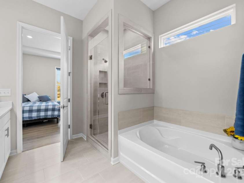197 Tetcott Street, Mooresville, NC 28115.  MLS# CAR4238933, YatesRealty ID 15313. Another view of the primary owner's suite tub & stand up shower.