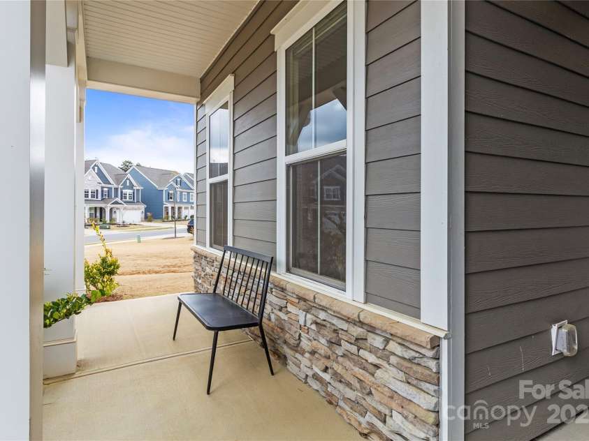 197 Tetcott Street, Mooresville, NC 28115.  MLS# CAR4238933, YatesRealty ID 15313. Enjoy coffee and tea on this front porch each day.