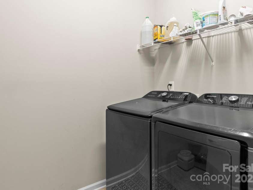 197 Tetcott Street, Mooresville, NC 28115.  MLS# CAR4238933, YatesRealty ID 15313. Main floor laundry room - washer and dryer stay.