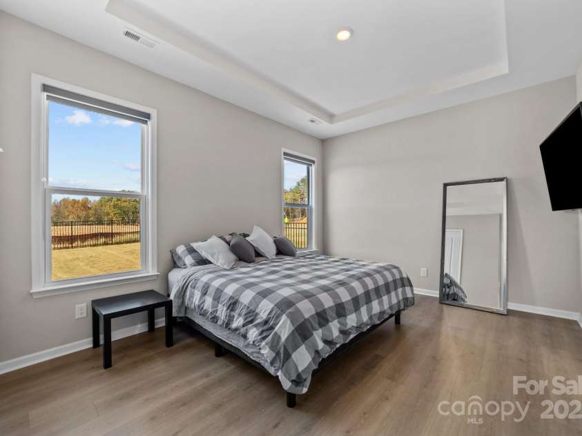 197 Tetcott Street, Mooresville, NC 28115.  MLS# CAR4238933, YatesRealty ID 15313. Main floor primary bedroom ensuite