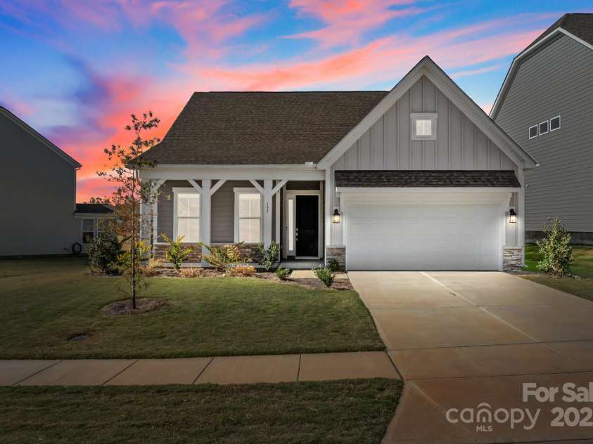 197 Tetcott Street, Mooresville, NC 28115.  MLS# CAR4238933, YatesRealty ID 15313. Twilight view of this beautiful home.