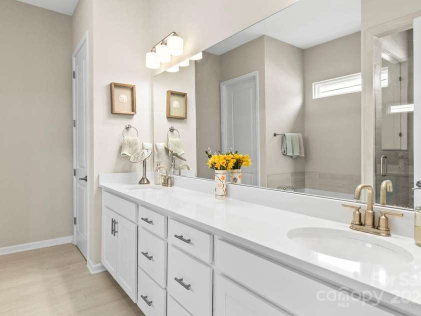 197 Tetcott Street, Mooresville, NC 28115.  MLS# CAR4238933, YatesRealty ID 15313. Wow - a huge primary owner's bathroom w/ dual sinks.