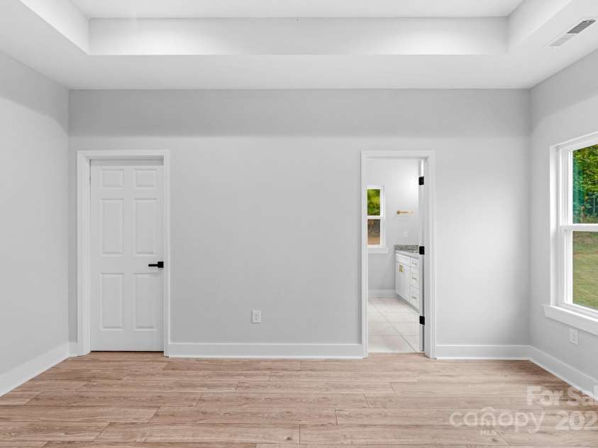 142 Crystal Heights Drive, Hendersonville, NC 28739.  MLS# CAR4310051, YatesRealty ID 15316. Entry into Primary Bath