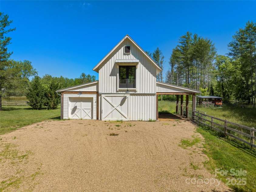 146 Lower Brush Creek Road, Fletcher, NC 28732.  MLS# CAR4262827, YatesRealty ID 15331. Barn on the lower level, studio office with full bathroom upstairs. Separate entrances for all the people and animals too!