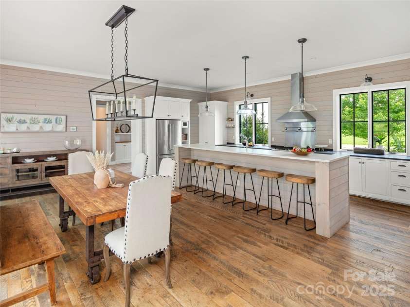 146 Lower Brush Creek Road, Fletcher, NC 28732.  MLS# CAR4262827, YatesRealty ID 15331. Large kitchen that flows right into the dining and outside spaces