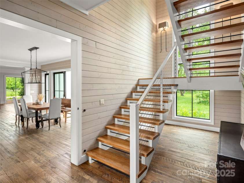 146 Lower Brush Creek Road, Fletcher, NC 28732.  MLS# CAR4262827, YatesRealty ID 15331. Stunning design choices allow natural light and the wood features to blend seamlessly